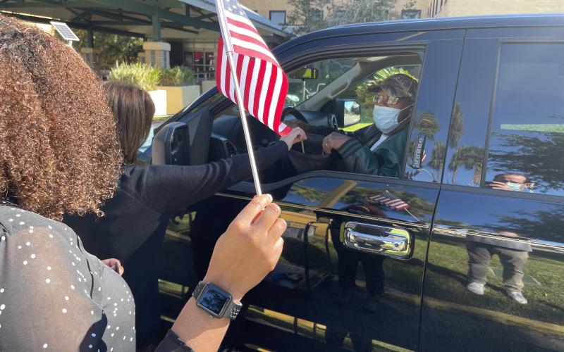 A military veteran receives gifts during a drive-through event at the Lake City VA Medical Center on Monday morning. (COURTESY)