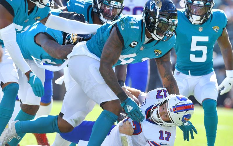 Jacksonville Jaguars linebacker Josh Allen (41) sacks Buffalo Bills quarterback Josh Allen (17) during Sunday's game at TIAA Bank Field in Jacksonville. (BOB SELF/Florida Times-Union/TNS)