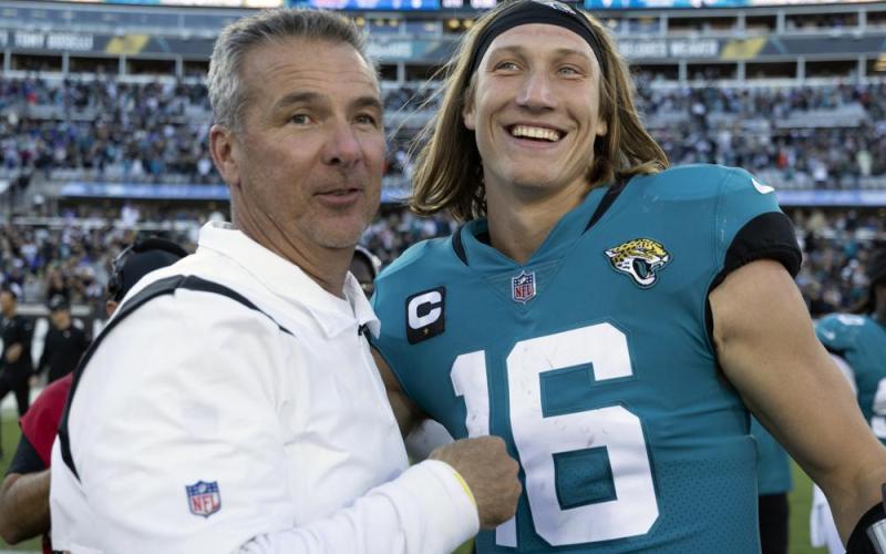 Jacksonville Jaguars head coach Urban Meyer, left, and quarterback Trevor Lawrence celebrate after defeating the Buffalo Bills on Sunday in Jacksonville. (AP Photo/STEPHEN B. MORTON/Associated Press)