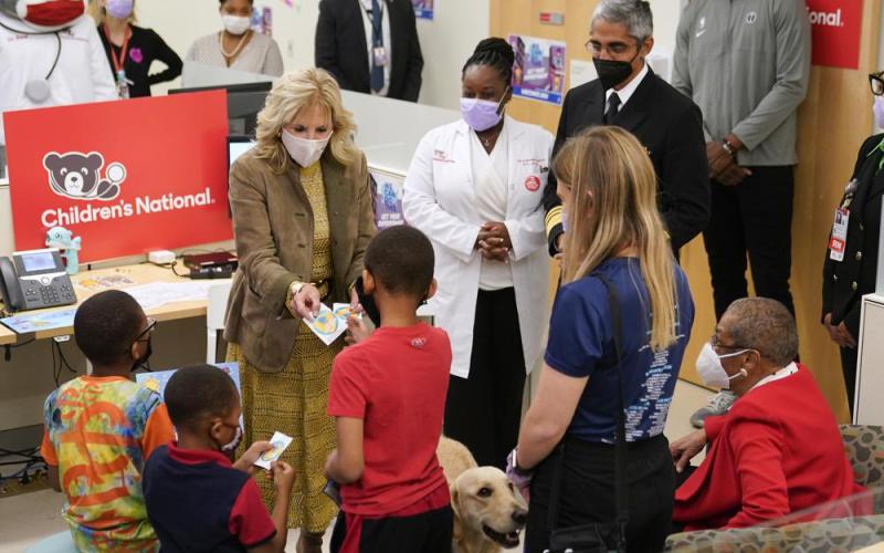 First lady Jill Biden hands out stickers to recently vaccinated children during a visit to a pediatric covid-19 vaccination clinic at Children's National Hospital's THEARC on Wednesday in Washington. (PATRICK SEMANSKY/Associated Press)