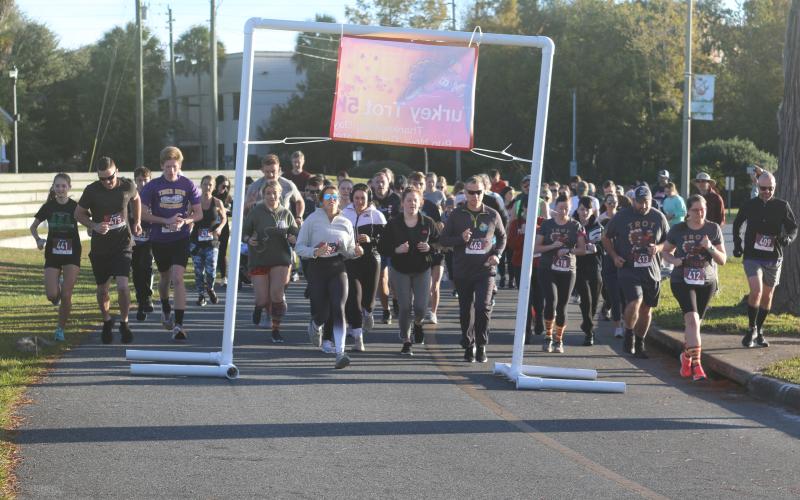 Nearly 90 runners participated in the inaugural Turkey Trot 5K on Thanksgiving morning in downtown Lake City. (JAMIE WACHTER/Lake City Reporter)