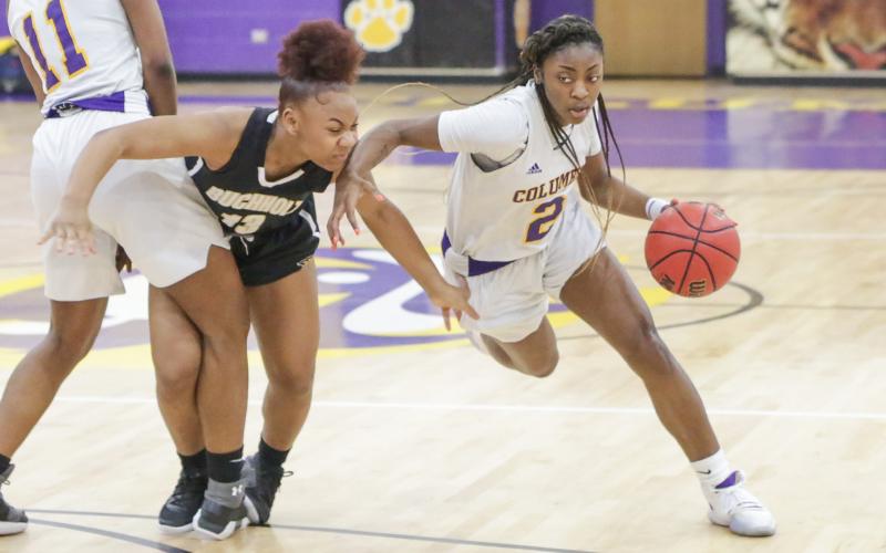 Columbia guard Na’Haviya Paxton drives to the basket against Buchholz during last season’s district championship game. (BRENT KUYKENDALL/Lake City Reporter)