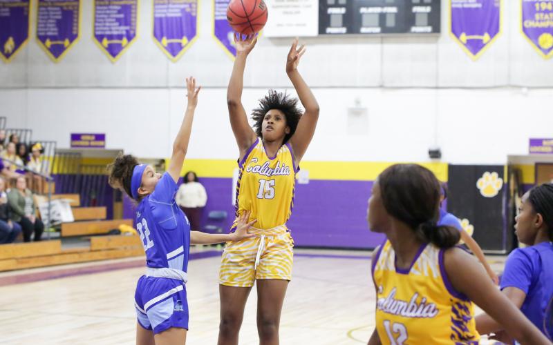 Columbia forward Jolena Gardner shoots over P.K. Yonge forward Niyah Williams on Tuesday night. (BRENT KUYKENDALL/Lake City Reporter)