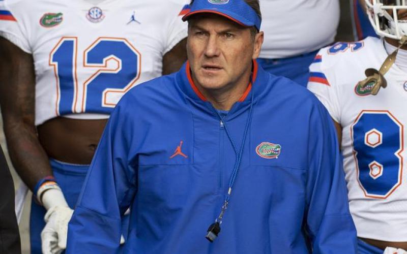 Florida head coach Dan Mullen walks with his team to the field prior to Saturday’s game against Missouri in Columbia, Mo. (L.G. PATTERSON/Associated Press)