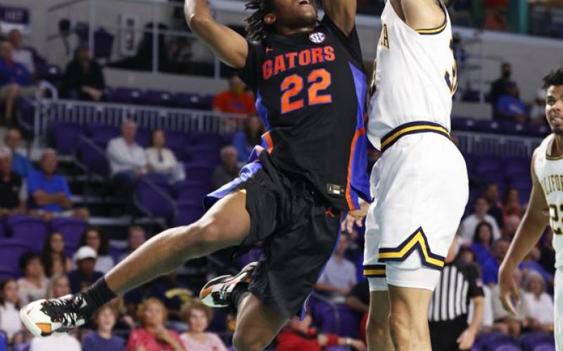 Florida guard Tyree Appleby drives to the basket against California guard Jordan Shepherd during Monday's game in Fort Myers. (SCOTT AUDETTE/Associated Press)