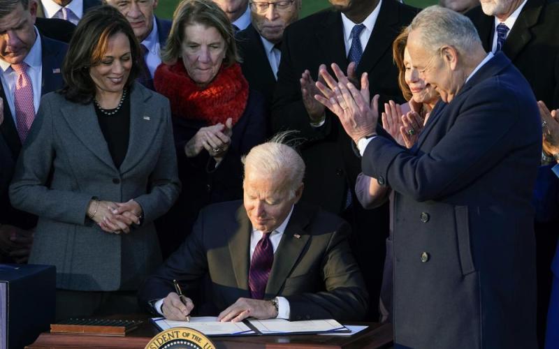 President Joe Biden signs the $1.2 trillion bipartisan infrastructure bill into law during a ceremony on the South Lawn of the White House in Washington. (SUSAN WALSH/Associated Press)