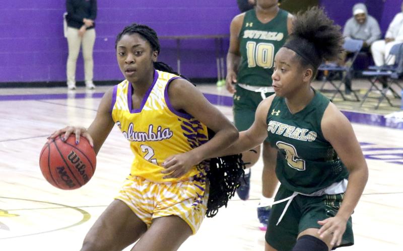Columbia guard Na’Haviya Paxton drives to the basketball against The Villages Charter on Tuesday night. (JORDAN KROEGER/Lake City Reporter)