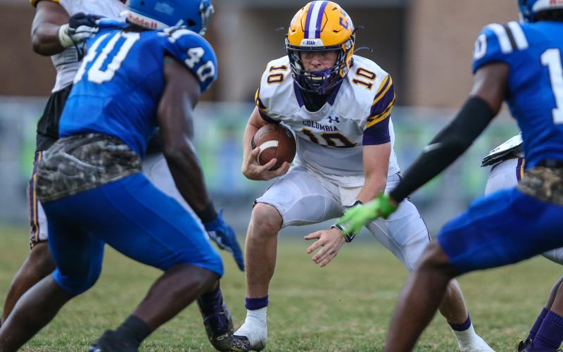 Columbia quarterback Kade Jackson scrambles from pressure against Riverside on Oct. 8. (GARY LLOYD MCCULLOUGH/Special to the Reporter)