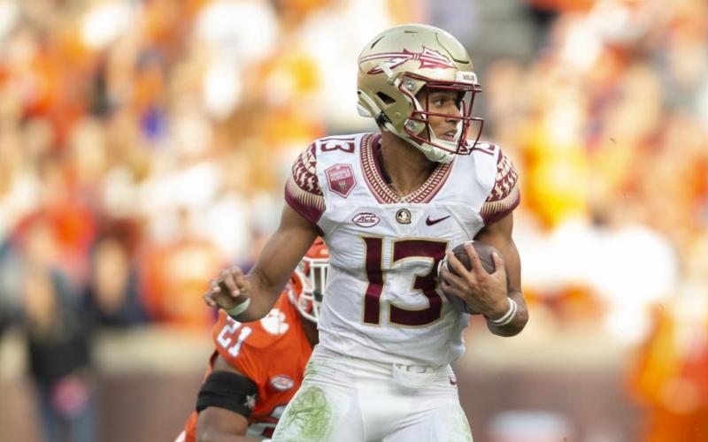Florida State quarterback Jordan Travis runs Clemson Oct. 30 in Clemson, S.C. (HAKIM WRIGHT SR./Associated Press)