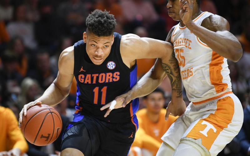 Florida forward Keyontae Johnson dribbles around Tennessee guard/forward Yves Pons on Feb. 29, 2020, in Knoxville, Tenn. (CALVIN MATTHEIS/Knoxville News Sentinel via AP File)