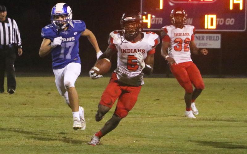 Fort White defensive back Darren Clark returns an interception against Interlachen on Friday. (MORGAN MCMULLEN/Lake City Reporter)
