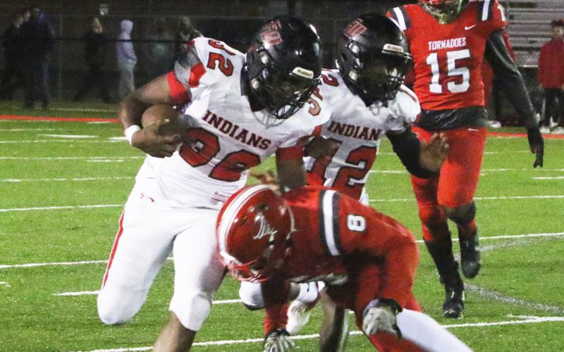Fort White running back Kamarion Griffin is tackled by Bradford defensive back Jarrin Alexander on Friday night. (MORGAN MCMULLEN/Lake City Reporter)