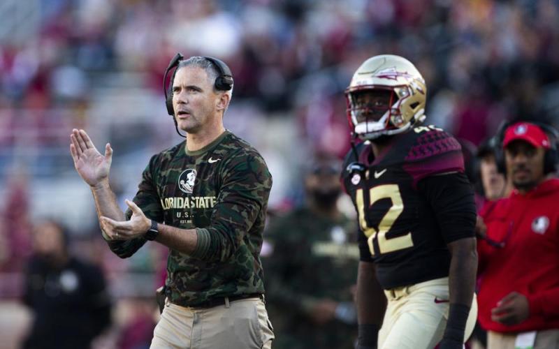 Florida State coach Mike Norvell applauds during a game against N.C. State on Nov. 6 in Tallahassee. (MARK WALLHEISER/Associated Press)