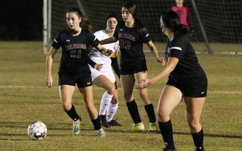 Columbia’s Sydney Rivas pushes the ball up the field against Lafayette on Monday night. (JORDAN KROEGER/Lake City Reporter)