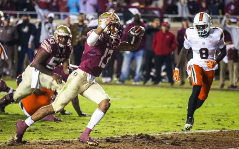 Florida State quarterback Jordan Travis scores a 2-point conversion with 25 seconds left against Miami on Saturday in Tallahassee. Florida State defeated Miami 31-28. (MARK WALLHEISER/Associated Press)