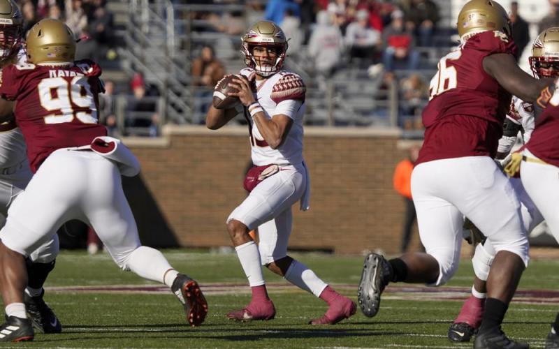 Florida State quarterback Jordan Travis looks to pass during Saturday's game against Boston College in Boston. (MARY SCHWALM/Associated Press)