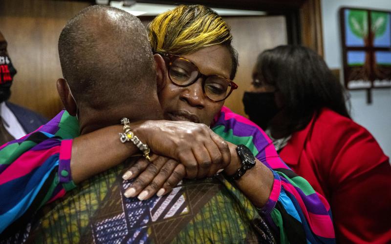 Ahmaud Arbery's mother, Wanda Cooper-Jones, is hugged by a supporter after the jury convicted Travis McMichael in the trial of McMichael, his father, Greg McMichael, and neighbor, William "Roddie" Bryan, on Wednesday in Brunswick, Ga. (STEPHEN B. MORTON/Pool/Getty Images/TNS)