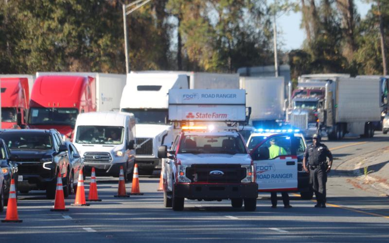 Traffic is diverted off Interstate 75 south at Ellisville on Thursday afternoon as a manhunt was underway for a suspect that shot at a Columbia County deputy. (TONY BRITT/Lake City Reporter)