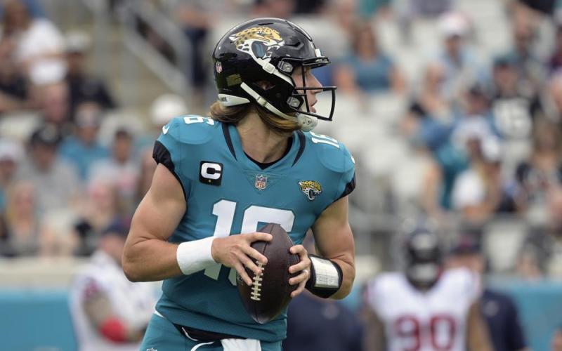 Jacksonville Jaguars quarterback Trevor Lawrence looks for a receiver against the Houston Texans on Dec. 19 in Jacksonville. (PHELAN M. EBENHACK/Associated Press)