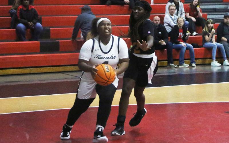 Fort White forward N’Coreyia Atkins drives to the basket against Eastside on Friday night. (MORGAN MCMULLEN/Lake City Reporter)