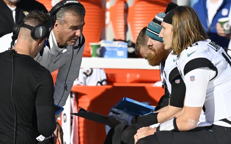 Jacksonville Jaguars head coach Urban Meyer speaks with Jacksonville Jaguars quarterback Trevor Lawrence (16) on the sideline during Sunday's game against the Tennessee Titans in Nashville, Tenn. (MARK ZALESKI/Associated Press)