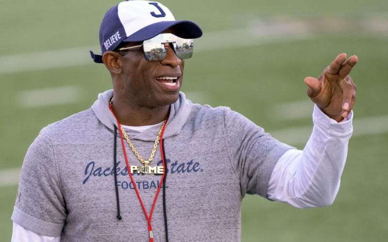 Jackson State head coach Deion Sanders points during a game against Louisiana Monroe on Sept. 18 in Monroe, La. Travis Hunter, the No. 1 high school football recruit in the country, pulled a signing day shocker on Wednesday deciding to attend Jackson State and play for coach Deion Sanders after being verbally committed to Florida State for months. (MATTHEW HINTON/Associated Press)