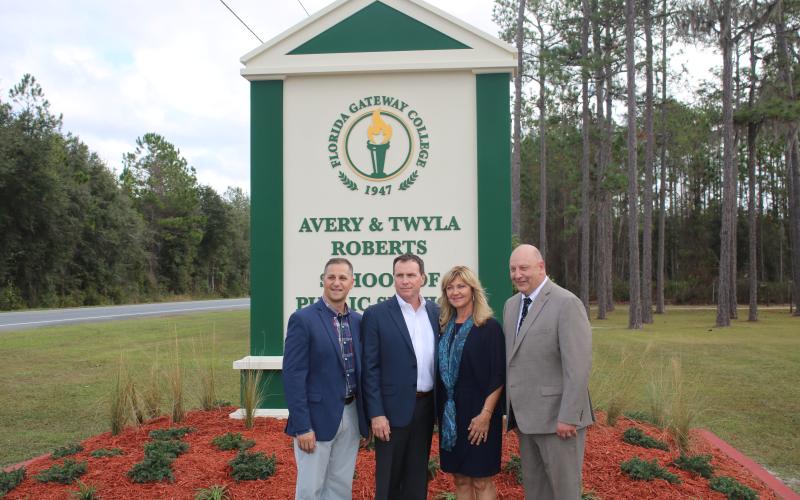 Avery and Twyla Roberts (middle) pose with FGC Foundation Executive Director Lee Pinchouck (left) and FGC President Lawrence Barrett Thursday. (TONY BRITT/Lake City Reporter)