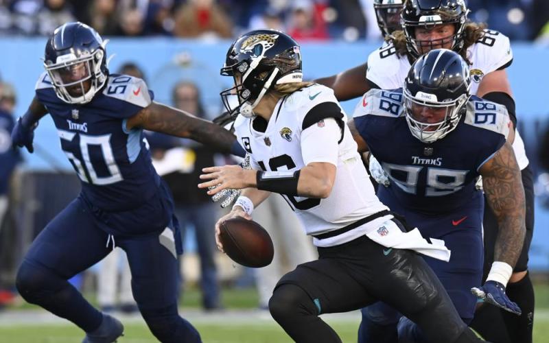 Tennessee Titans defensive end Jeffery Simmons (98) chases Jacksonville Jaguars quarterback Trevor Lawrence during Sunday's game in Nashville, Tenn. (MARK ZALESKI/Associated Press)