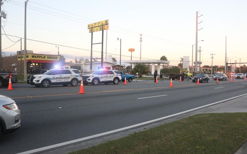 Lake City Police Department vehicles cordone off a stretch of road on U.S. Highway 90 west of Interstate 75 on Tuesday afternoon. One pedestrian was killed while no other injuries were reported. (MORGAN MCMULLEN/Lake City Reporter)