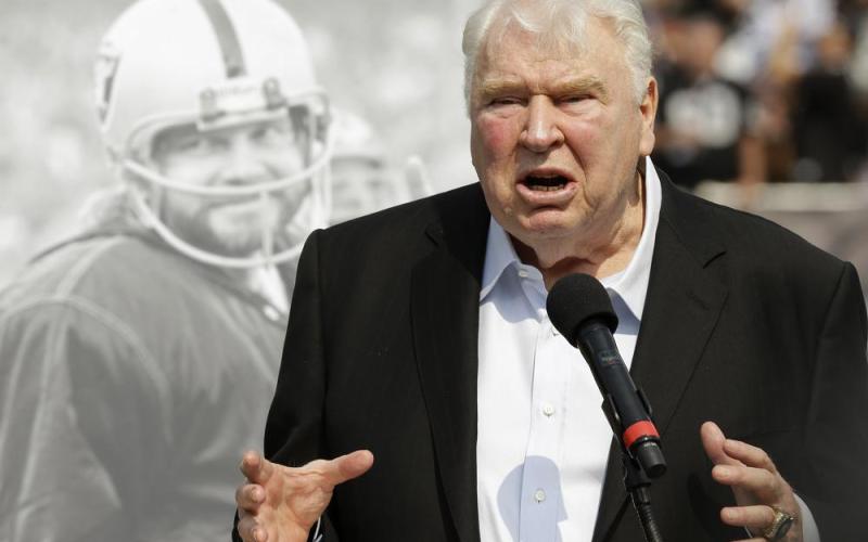 Former Oakland Raiders head coach John Madden speaks about former quarterback Ken Stabler, pictured at rear, at a ceremony honoring Stabler during halftime of a game between the Raiders and the Cincinnati Bengals on Sept. 15, 2015, in Oakland, Calif. (AP File)