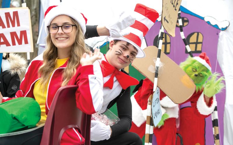 The Cat in the Hat and Grinch wave from a float during last year’s Fort White Business Council Christmas parade. This year’s parade is scheduled for Saturday at noon. (JEN CHASTEEN/Special to the Reporter)
