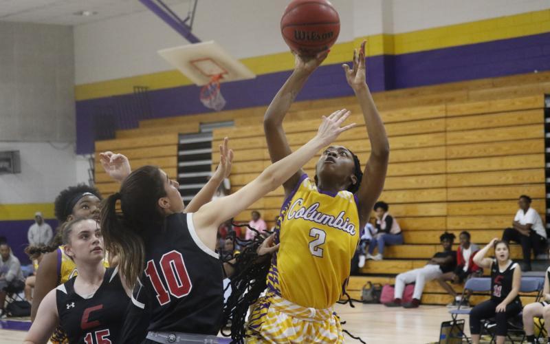 Columbia guard Na’Haviya Paxton shoots over Creekside guard Lauren Yezbick during a Dec. 9 game at CHS. (JORDAN KROEGER/Lake City Reporter)