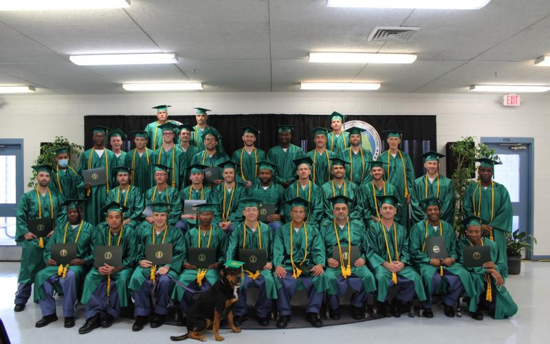 The 37 graduates from the FDC’s Second Chance Pell program display their diplomas from Florida Gateway College on Dec. 15. (COURTESY)