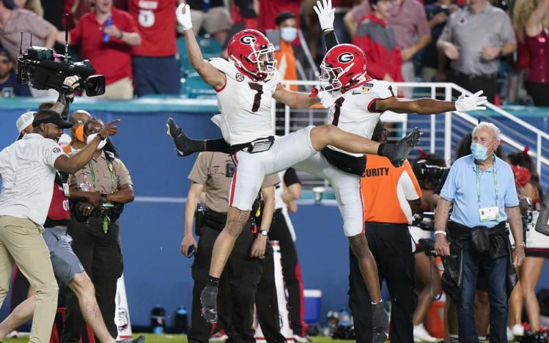 Georgia wide receiver Jermaine Burton celebrates after scoring with wide receiver George Pickens against Michigan during the Orange Bowl College Football Playoff semifinal on Friday in Miami Gardens. (LYNNA SLADKY/Associated Press)