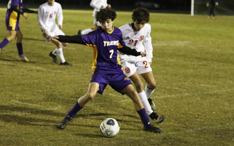 Columbia’s Wesley Wingate battles for possession of the ball with Leon’s Andres Fernandez on Wednesday night. (JORDAN KROEGER/Lake City Reporter)