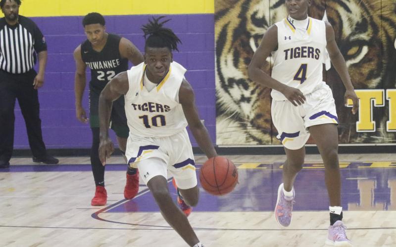 Columbia guard Isaac Broxey pushes the ball up the court in transition against Suwannee on Friday. (JORDAN KROEGER/Lake City Reporter)