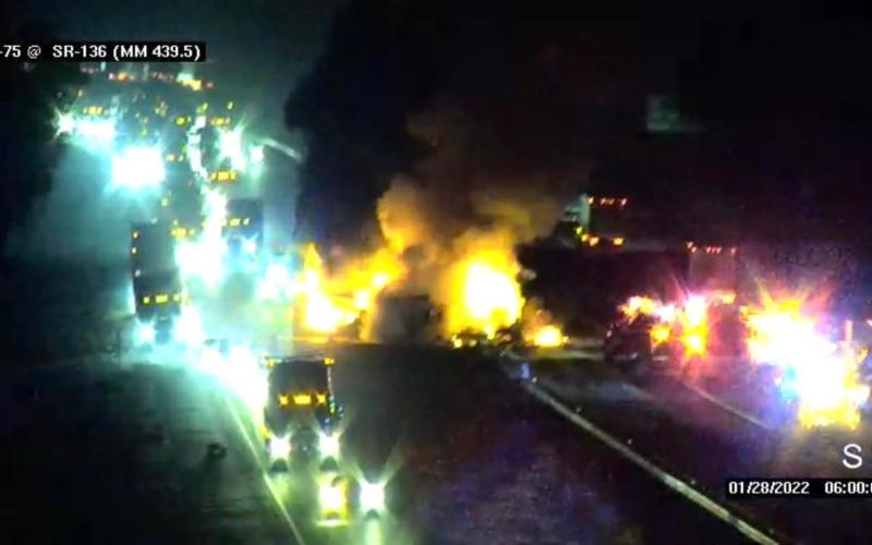 Footage from a camera overlooking I-75 shows a semi truck on the right ablaze as traffic stalled behind it. (COURTESY)