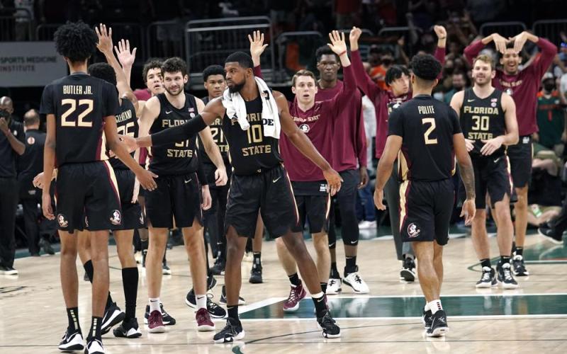 Florida State forward Malik Osborne celebrates with his teammates the Seminoles defeated Miami 61-60 on Saturday in Coral Gables. (LYNNE SLADKY/Associated Press)