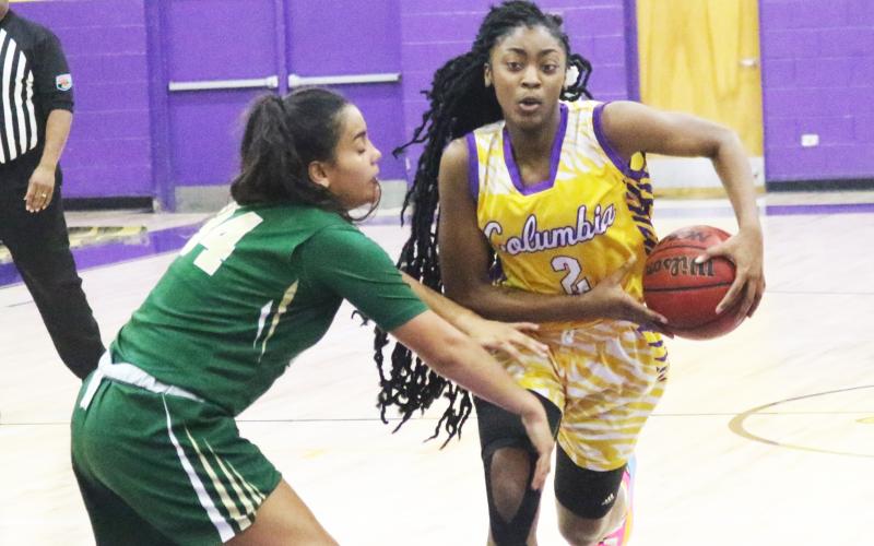 Columbia guard Na’Haviya Paxton drives to the basket as Nease guard Savannah Gomes defends on Tuesday night. (JORDAN KROEGER/Lake City Reporter)