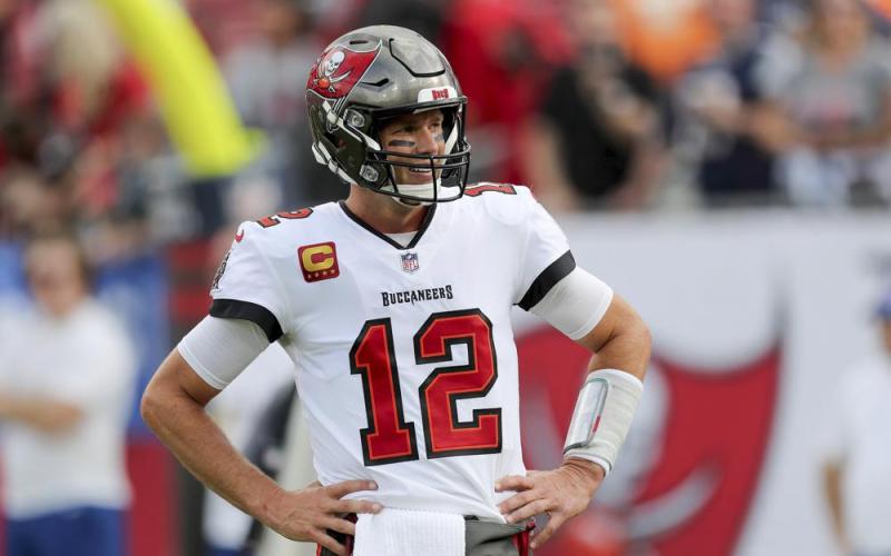 Tampa Bay Buccaneers quarterback Tom Brady looks at the sideline for instructions during a game against the Carolina Panthers on Jan. 9 in Tampa. The Buccaneers play the Philadelphia Eagles in an NFC wild-card game on Sunday. (ALEX MENENDEZ/Associated Press)