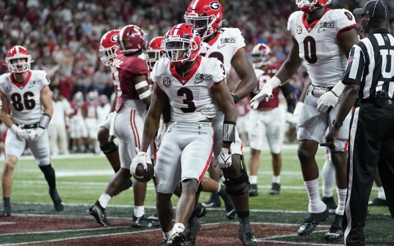 Georgia’s Zamir White celebrates after running for a touchdown during the second half of the College Football Playoff championship football game against Alabama Monday, Jan. 10, 2022, in Indianapolis. (PAUL SANCYA/Associated Press)