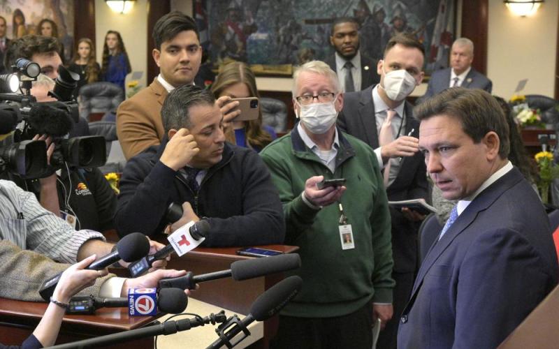 Florida Gov. Ron DeSantis, right, answers questions from reporters after addressing a joint session of a legislative session, Tuesday, Jan. 11, 2022, in Tallahassee, Fla. (PHELAN M. EBENHACK/Associated Press)