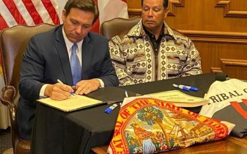 Gov. Ron DeSantis and Seminole Tribe of Florida Chairman Marcellus Osceola Jr. signed a gambling deal in April. (COURTESY)
