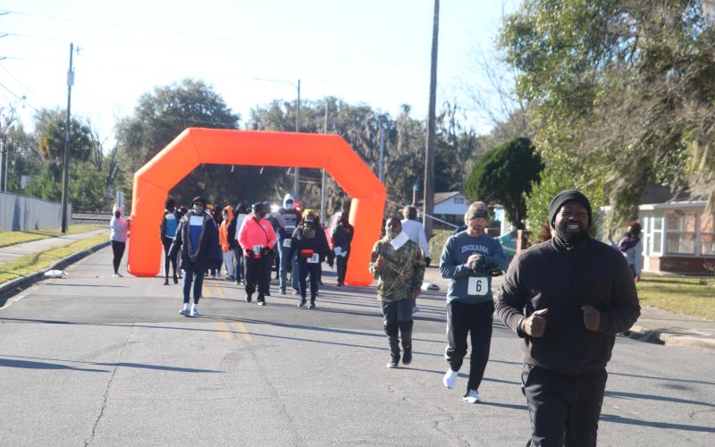 An estimated 40-60 people participated in the inaugural MLK Day 3K Walk/Run event in Lake City. (TONY BRITT/Lake City Reporter)