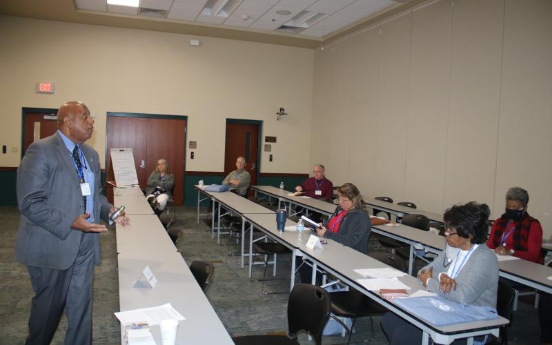 NorthStar Family Resource Center Manager Philip Mobley (left) gives a lesson on building strategies for non-profits. (TONY BRITT/Lake City Reporter)