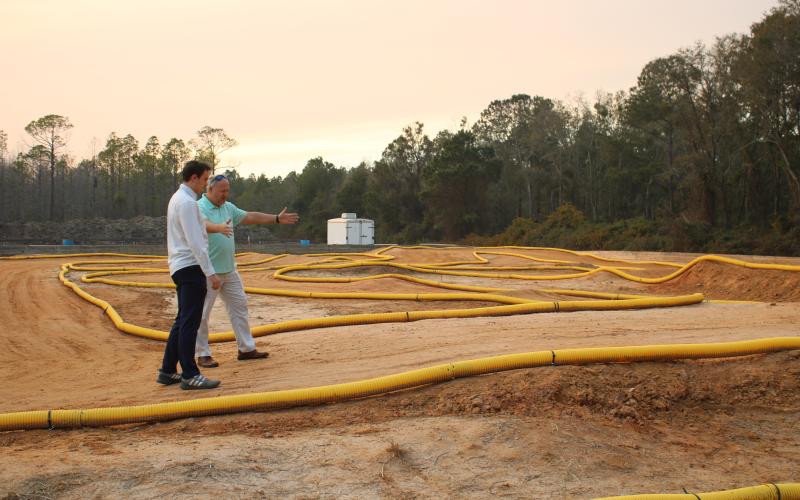 Landen Lewis (left) and Lance McDonald look over the track Thursday afternoon for the Florida RC Championship. (TONY BRITT/Lake City Reporter)