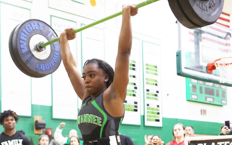 Suwannee lifter Tyra Kalandyk finishes her clean and jerk during the Region 1-1A Meet on Friday. (PAUL BUCHANAN/Special to the Reporter)
