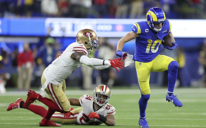 Los Angeles Rams receiver Cooper Kupp (10) gets past San Francisco 49ers safety Jaquiski Tartt, left, and cornerback K'Waun Williams (24) during the NFC Championship game on Sunday in Inglewood, Calif. (JED JACOBSOHN/Associated Press)