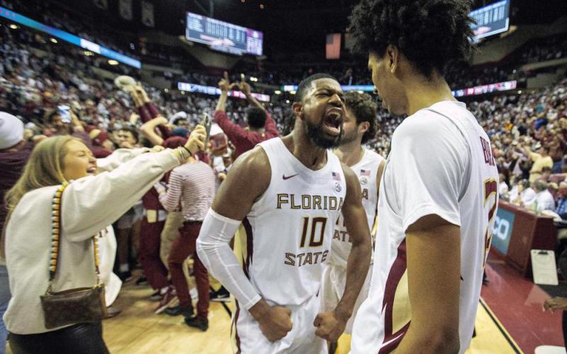 Florida State forward Malik Osborne (10) and forward John Butler (22) celebrate beating Duke 79-78 in overtime on Tuesday in Tallahassee. (MARK WALLHEISER/Associated Press)