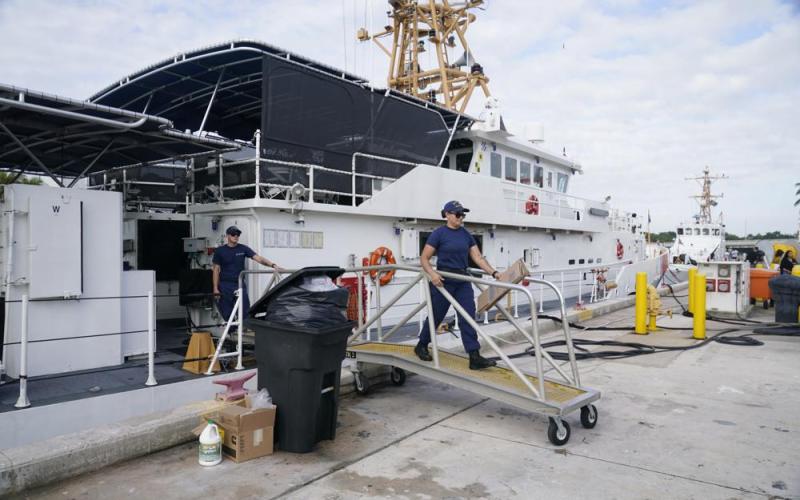 Crew members of the Coast Guard cutter William Flores get ready to go on patrol in Miami Beach. About 40 people left the island of Bimini in the Bahamas on Saturday evening in what the maritime security agency suspects was a human smuggling operation. (MARTA LAVANDIER/Associated Press)